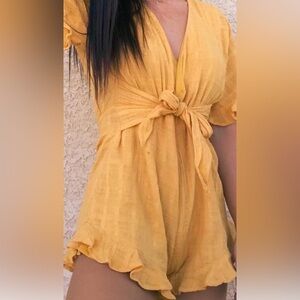 Indikah yellow romper tie front or back zip back ruffle sleeve and hem US size L